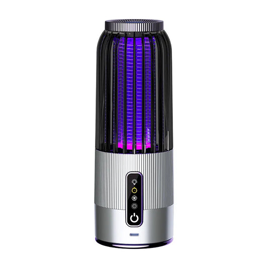 Black and silver electronic device with purple light on a white background