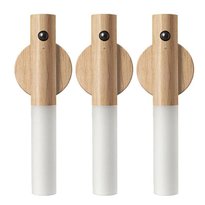 Three wooden and white cordless torches on a white background