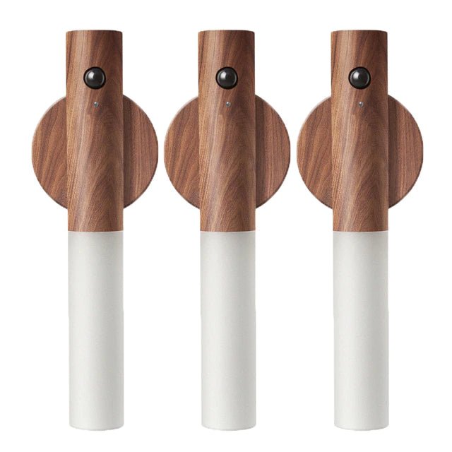 Three wooden cordless torches with white bases on a white background